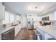 Bright kitchen featuring white cabinets, stainless steel appliances, and ample counter space at 14770 W Columbine Dr, Surprise, AZ 85379