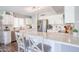 Bright kitchen featuring white cabinets, stainless steel appliances, and a subway tile backsplash at 14770 W Columbine Dr, Surprise, AZ 85379