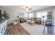 Inviting living room with comfortable leather sofas, area rug, and plenty of natural light at 14770 W Columbine Dr, Surprise, AZ 85379