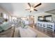Spacious open-concept living room and dining area with lots of natural light and wood flooring at 14770 W Columbine Dr, Surprise, AZ 85379