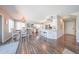 Open-concept dining and kitchen area with stylish flooring and abundant natural light at 14770 W Columbine Dr, Surprise, AZ 85379