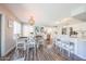 Open-concept dining and kitchen area with stylish flooring and abundant natural light at 14770 W Columbine Dr, Surprise, AZ 85379