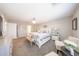 Comfortable main bedroom with large windows, decor, and carpet flooring at 14770 W Columbine Dr, Surprise, AZ 85379