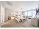 Spacious main bedroom with carpet flooring, chandelier, and lots of natural light at 14770 W Columbine Dr, Surprise, AZ 85379