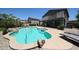 Backyard pool area complete with a pool, stone detailing, and lounge chairs at 14770 W Columbine Dr, Surprise, AZ 85379
