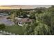 Aerial view featuring lush greenery, a large lawn, and the property's outdoor spaces against a scenic backdrop at 1522 W Myrtle Ave, Phoenix, AZ 85021