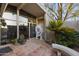 Modern front entrance featuring desert landscaping, architectural elements, and a tiled patio at 1522 W Myrtle Ave, Phoenix, AZ 85021