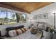 Cozy living room with wood plank ceiling, comfortable seating, and bright natural light at 1522 W Myrtle Ave, Phoenix, AZ 85021