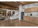 Bright living room features a cozy fireplace, a large sofa, and wood ceiling at 1522 W Myrtle Ave, Phoenix, AZ 85021