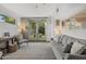 Cozy living room with natural light and access to the backyard at 1522 W Myrtle Ave, Phoenix, AZ 85021