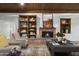 Comfortable living room showcasing a fireplace, built-in bookshelves, and stylish decor at 1522 W Myrtle Ave, Phoenix, AZ 85021