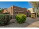 Inviting single-story home featuring desert landscaping, a two-car garage, and exterior lighting at 15674 W Mackenzie Dr, Goodyear, AZ 85395