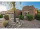 Attractive single-story home with desert landscaping, a two-car garage, and an inviting facade at 15674 W Mackenzie Dr, Goodyear, AZ 85395