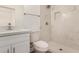 Bathroom featuring quartz countertops, a new toilet, and a marble shower at 162 N Hunt W Dr, Mesa, AZ 85203
