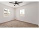 Bedroom featuring neutral carpet and two windows with natural light at 162 N Hunt W Dr, Mesa, AZ 85203