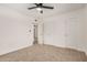 Bedroom featuring neutral carpet, ceiling fan, and doorway to another bedroom at 162 N Hunt W Dr, Mesa, AZ 85203