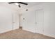 Bedroom featuring neutral carpet and doorway to closet and bathroom at 162 N Hunt W Dr, Mesa, AZ 85203