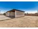 View of the detached carport with lattice privacy wall and a fenced in dirt lot at 162 N Hunt W Dr, Mesa, AZ 85203