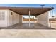 Covered carport with white brick walls and an opening with lattice work for privacy at 162 N Hunt W Dr, Mesa, AZ 85203