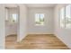 Inviting dining area with wood-look flooring, white trim, and a view of the outdoors at 162 N Hunt W Dr, Mesa, AZ 85203