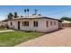 Charming home featuring a well-kept lawn, bright exterior, and inviting outdoor space at 162 N Hunt W Dr, Mesa, AZ 85203