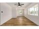 Bright, airy living room with wood-look floors, white trim, and ample natural light at 162 N Hunt W Dr, Mesa, AZ 85203