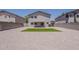 Large backyard with gravel, artificial turf, and a covered patio, perfect for outdoor living at 1671 E Silktassel Trl, San Tan Valley, AZ 85143