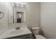 View of half-bath including a white commode and single-sink vanity at 1671 E Silktassel Trl, San Tan Valley, AZ 85143