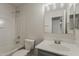 Bathroom with a shower-tub combo, toilet, and vanity with large mirror at 1671 E Silktassel Trl, San Tan Valley, AZ 85143