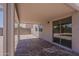 Covered patio with a decorative concrete floor and sliding glass doors at 1671 E Silktassel Trl, San Tan Valley, AZ 85143