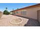 Side view of backyard features manicured gravel and desert landscaping at 19007 N 79Th Dr, Glendale, AZ 85308
