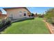 Well-kept lawn and stone landscaping enhance the backyard's peaceful and serene setting at 19007 N 79Th Dr, Glendale, AZ 85308