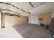 Clean and organized garage with ample storage cabinets and space for vehicles and equipment at 19007 N 79Th Dr, Glendale, AZ 85308
