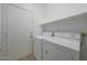 The laundry room offers a washer and dryer with ample space for convenience at 19007 N 79Th Dr, Glendale, AZ 85308