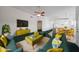 Green themed living room with dark green carpet, green sofa, and wooden furniture at 19007 N 79Th Dr, Glendale, AZ 85308
