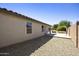 Well maintained xeriscaped backyard and covered patio with access to home at 2011 W Burgess Ln, Phoenix, AZ 85041