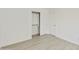 Bright bedroom offering wood floors and a closet with sliding doors at 2011 W Burgess Ln, Phoenix, AZ 85041