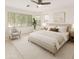 Bright bedroom with neutral decor, large windows, ceiling fan, and stylish furnishings at 2011 W Burgess Ln, Phoenix, AZ 85041