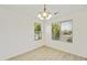 Bright dining room features white walls, recessed lighting and big windows at 2011 W Burgess Ln, Phoenix, AZ 85041
