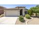 Charming single-Gathering home with a two-car garage and desert landscaping at 2011 W Burgess Ln, Phoenix, AZ 85041
