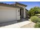 Low angle of a charming single-Gathering home with a garage and desert landscaping at 2011 W Burgess Ln, Phoenix, AZ 85041