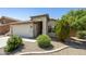 Charming single-story home showcasing desert landscaping and a two-car garage at 2011 W Burgess Ln, Phoenix, AZ 85041