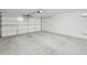 Spacious two-car garage with an automatic door opener and a concrete floor at 2011 W Burgess Ln, Phoenix, AZ 85041