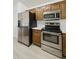 Bright kitchen features stainless steel appliances and white countertops at 2011 W Burgess Ln, Phoenix, AZ 85041