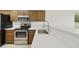 Updated kitchen with stainless steel appliances and quartz countertops at 2011 W Burgess Ln, Phoenix, AZ 85041