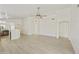 Open floor plan with new floors, ceiling fan, and arched doorways at 2011 W Burgess Ln, Phoenix, AZ 85041