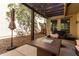 Cozy backyard patio with a fire pit table and shaded seating area at 21014 W Ridge Rd, Buckeye, AZ 85396