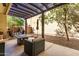 Inviting patio with comfortable seating, pergola, and low-maintenance backyard at 21014 W Ridge Rd, Buckeye, AZ 85396