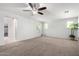 Spacious bedroom with carpeted floors, bright windows, and ample natural light at 21014 W Ridge Rd, Buckeye, AZ 85396