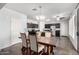 Open floor plan featuring a dining area with a wood table near the kitchen at 21014 W Ridge Rd, Buckeye, AZ 85396
